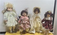 Porcelain Collectors dolls with stands. All need