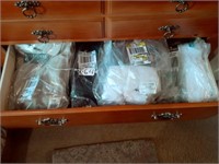 drawer full of new clothing items