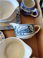 Blue and white cream, sugars, cups and saucers.