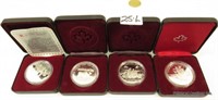 4 Canadian Royal Mint Dollars In Cases