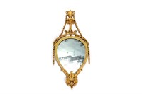 A FINE CARVED GILTWOOD MIRROR