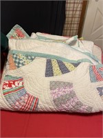 Homemade quilt tops have wear & blanket