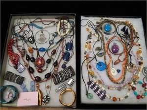 Two containers of beaded jewelry including