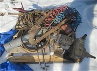 Pallet of parts including tire chains, air hose,