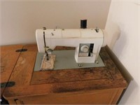 Vintage Sears Kenmore sewing machine in wooden