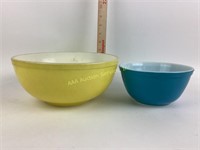 Two Pyrex bowls, very dirty, yellow, and blue