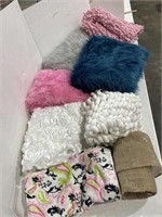 Assorted furs, blankets and rugs only ever used