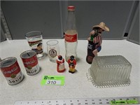 Coca-Cola bottles, soup can banks, Superman glass,