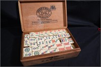 Cigar box full of Mahjong tiles