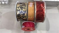 Four rolls of wire edge ribbon, holiday or other