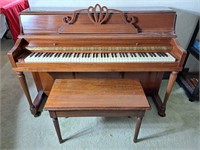 Classic piano with bench.