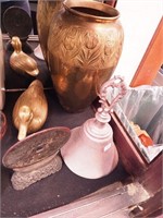 Four metal items including a hand bell, brass
