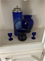 cobalt blue straw holder, 2 eye wash cups, vase +