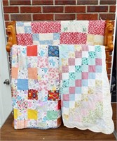 Quilt rack with 3 vintage quilts. Quilts in fair