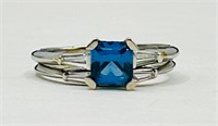 Platinum blue topaz and diamond ring