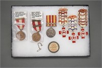 7 items: Red Cross medals, buttons, etc.