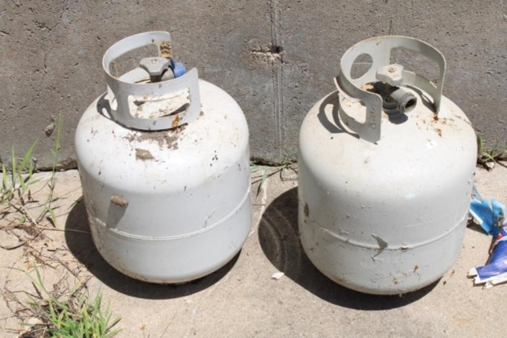 2 Propane Bottles (1 Full & One 1/2 Full)