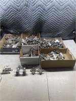 Large quantity of cupboard door hinges and catches