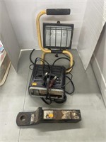 Utility light, battery charger, hitch receiver