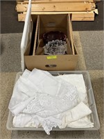 Tote of curtains and box of red glass, crystal