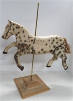 Tin carousel horse with wood base. Measures: