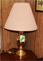 Table lamp with gold trim and white fabric shade