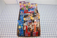 LOT OF PEZ DISPENSERS- CANDY IS OUT OF DATE