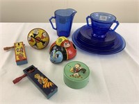 Metal noisemakers, toys, blue glass dishes