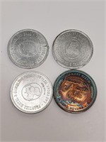 Four Gaming Tokens, 3 Frontier and 1 Monte Carlo