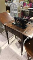 Vintage singer sewing machine with the cabinet
