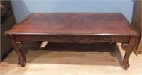 Carved wood coffee table, 48" x 17.5" x 23.5",