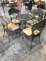 Glass-topped patio table w/ 4 chairs