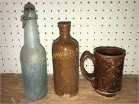 Antique stopper top beer bottle and crock items