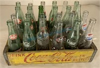 Crate of vintage pop bottles
