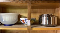 Shelf lot, stainless steel bowls, ceramic sun