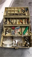 Fishing tackle box filled with lures, sinkers,