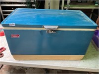 Vintage ice chest with water jug inside