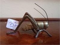 Articulated brass grasshopper