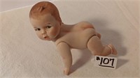 5” Bisque Jointed Crawling Baby Doll.