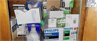 Numerous boxes of light bulbs different watts