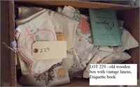 old wooden box w vintage linens, etiquette book