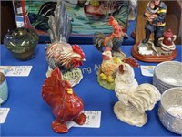 FOUR RESIN AND CERAMIC ROOSTER STATUETTES