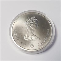 $900 Silver Olympia 10 Dollar  Coin