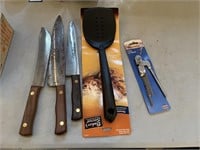 3 butcher knives, 2 spatulas and can opener