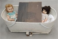 Baby bassinet, ship print on wood, and 2 dolls