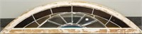 Antique stained and leaded glass curved window