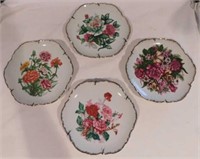 4 Dan Brechner porcelain floral plates, 7" -