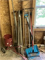 assorted lawn tools and seeder