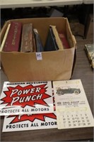 BOX OF AUTOMOBILE MANUELS AND SIGNS