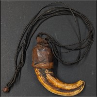 A Very Early Boar Tusk Wrapped In Leather Necklace